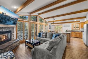 a living room with a couch and a fireplace at 4 Jay Lane in Sunriver