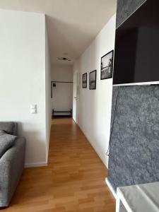 a living room with a couch and a flat screen tv at Ferienwohnung in der Innenstadt in Euskirchen