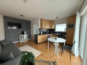 a living room and kitchen with a table and a couch at Ferienwohnung in der Innenstadt in Euskirchen