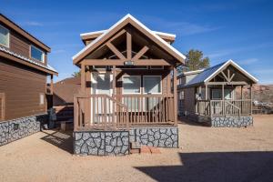 a house with a front porch and a porch at Arches Hut in Moab