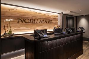 a hotel lobby with a nobu hotel sign on the wall at Nobu Hotel Atlantic City - A Caesars Rewards Destination in Atlantic City +16 photos