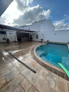 a swimming pool in the middle of a building at Apartamentos luz de Doñana 1 in Moguer