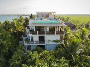 an aerial view of a house on the beach at Azure Horizon Suite in Balcheil