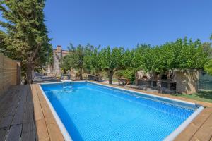 a swimming pool in a yard with trees at Petrino pool house in Athens