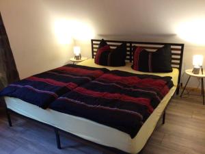 a bedroom with a large bed with pillows on it at Welsh Dragon in Siedlung Schönwalde +33 photos