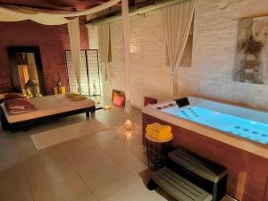 a large bathroom with a tub in a room at iRelax studio - privatni wellness in Prague +10 photos