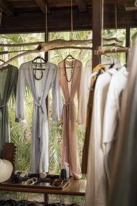 a group of dresses on display in a store at Coral Breeze Retreat in Balcheil