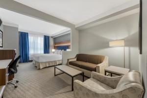 a hotel room with a couch and a bed at Best Western Plus Revelstoke in Revelstoke +80 photos