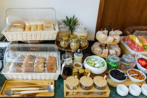 a table topped with baskets of pastries and other foods at Hotel Palacio del Agua by Faranda Boutique in Cartagena de Indias