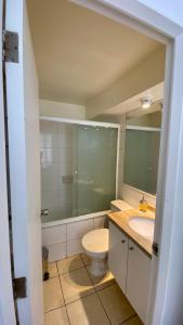 a bathroom with a toilet and a sink at Borde Costero in Valparaíso