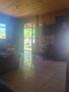a living room with a couch and a table at Casa da praia sulmar in Balneário Gaivotas