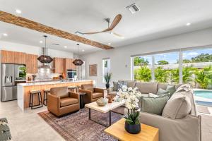 a living room with a couch and a table at Waldemere's Wonderland in Sarasota