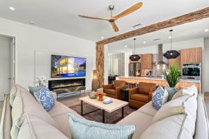 a living room with a couch and a fireplace at Waldemere's Wonderland in Sarasota