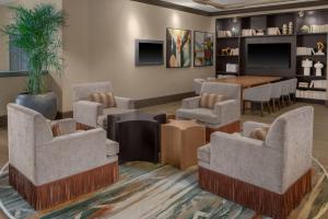 a waiting room with chairs and a table at Embassy Suites San Antonio Riverwalk-Downtown in San Antonio