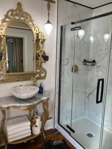 a bathroom with a sink and a shower at US Grant Guest House in Galena
