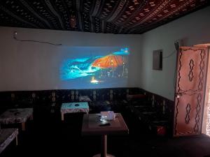 a room with a couch and a table and a painting at قمه التجلي in Saint Catherine