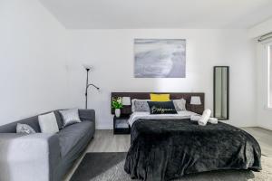 a living room with a bed and a couch at AYZ Juan de Mena - Auto check-in property in Madrid