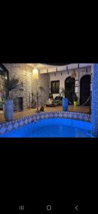 a picture of a swimming pool in a house at sharing is caring in Tamraght Ouzdar