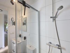 a bathroom with a shower and a sink at Steltloper in Nunspeet +41 photos