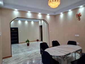 a meeting room with a table and a large mirror at Pelican VVIP Villa in Wa