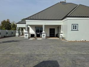 a large white house with a large driveway at Pelican VVIP Villa in Wa