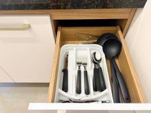 a drawer filled with utensils in a kitchen at AP Smart Samaritan Fast Internet Office in Campinas