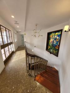a room with a staircase with a painting on the wall at AYZ Silvela - Auto check-in property in Málaga