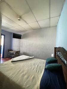 a room with a bed and a table in it at Casa Bienestar in Guatemala +48 photos
