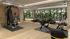 a gym with treadmills and ellipticals in a building at The Bauhinia Hotel - Central in Hong Kong