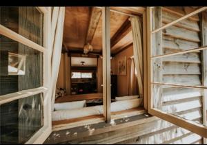 an open window in a room with a bed at Edens retreat in Upper Moutere