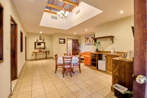 a kitchen and dining room with a table and chairs at Nico Hotel in Antigua Guatemala