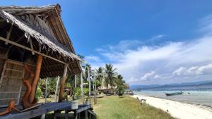 a resort on the beach with a view of the ocean at Yefkabu Homestay in Jef Tsiep