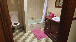 a bathroom with a toilet and a sink and a tub at Peaceful Haven Guest House, in Adelaide +19 photos