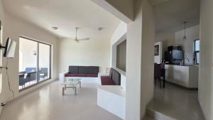 a living room with a couch and a table at Casa Chaue in Tangolunda