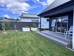 a backyard with a rv parked on a house at Bestern on Mohaka in Napier