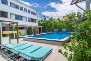 a swimming pool in the backyard of a building at Brisa do Mar Praia Hotel in Morro de São Paulo