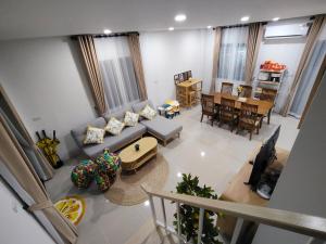 an overhead view of a living room with a couch at Dolce Home suratthani in Suratthani