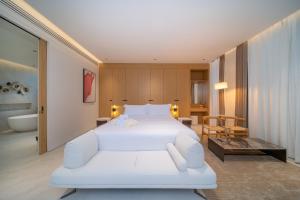 a bedroom with a white bed and a bathroom at Asherah Villa By Asherah Team in Ban Phru Champa +288 photos