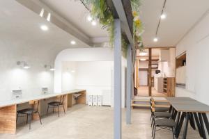 a kitchen and dining room with a table and chairs at one space 泊まれるコワーキングスペース in Kawatana