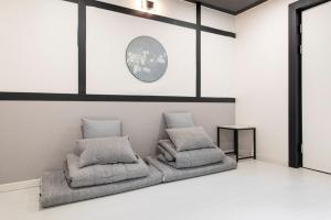 a room with two pillows sitting on the floor at Ryokan Stay in Gangneung