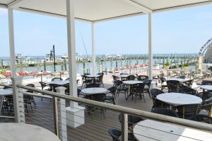 a balcony with tables and chairs on a cruise ship at Rod 'N' Reel Resort in Chesapeake Beach