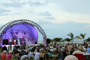 a crowd of people watching a concert at the beach at Rod 'N' Reel Resort in Chesapeake Beach +57 photos