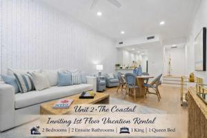 a living room with a couch and a table at Boutique condo w oceanfront & concierge in Palm Beach