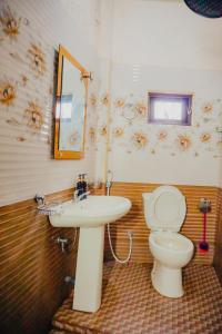 a bathroom with a sink and a toilet at SECRET MIRAGE Ella in Ella +36 photos
