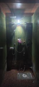 a dark bathroom with a sink and a light at Mangrove House Lanta Old Town in Ko Lanta +71 photos