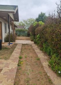a walkway in front of a house at Algarrobo, house in a condominium in Algarrobo