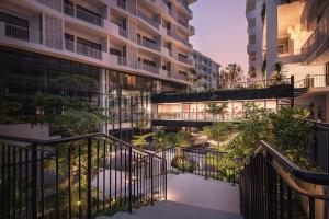 an image of an apartment building at dusk at Velea Serviced Apartments & Suites in Siem Reap