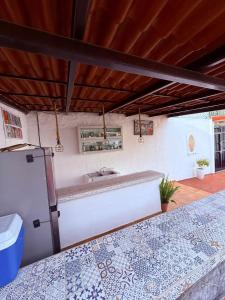 a kitchen with a bath tub in a room at Serenity House Casa Huaxtla del Arenal in Huastla