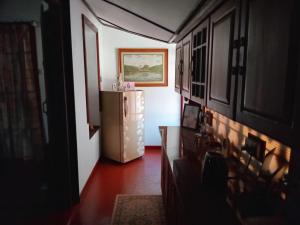 a hallway with a refrigerator in a room at The Garden Villa in Matara