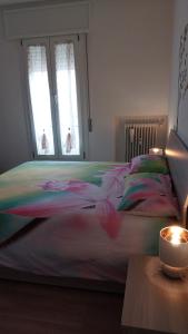 a large bed in a bedroom with two windows at A 3 passi da tutto in Treviso